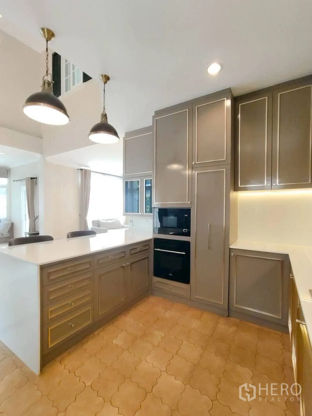 Detached House for rent in Bang Na, Bangkok - Built-in cabinetry with oven and storage surrounding the island.