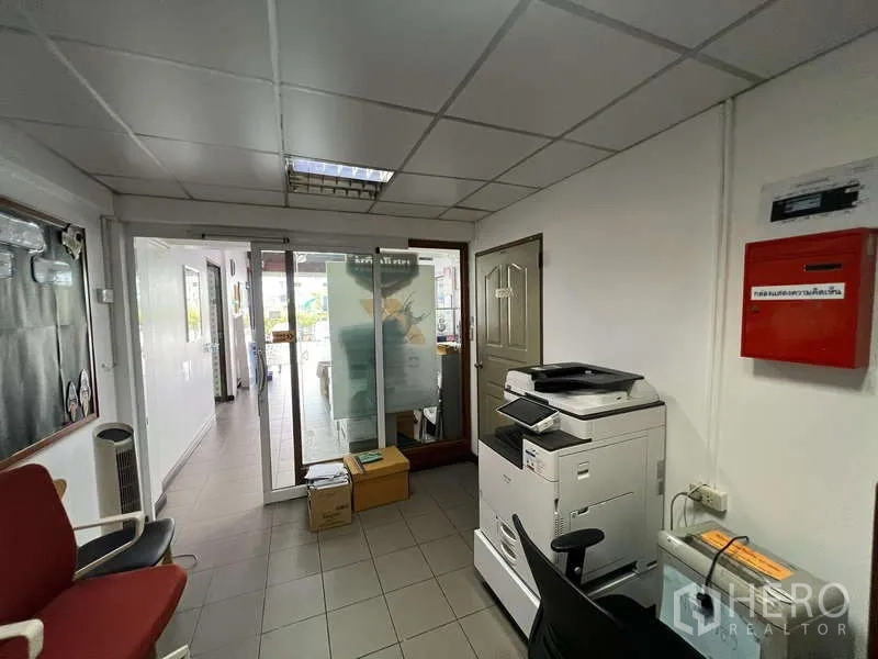 Office Space for rent - Small reception and copy area with sliding glass entrance.