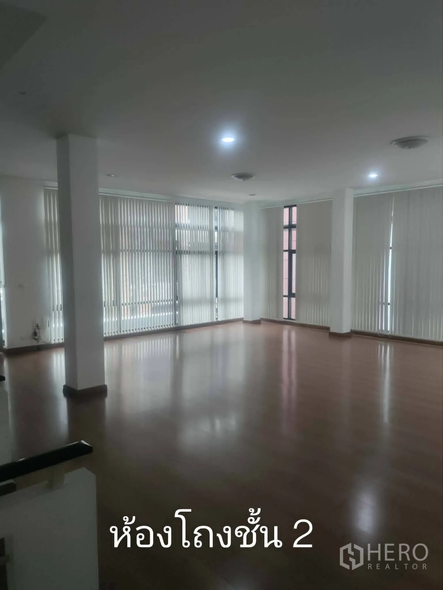Home Office for rent in Lat Phrao, Bangkok - Another view of the open-plan room with tall windows.