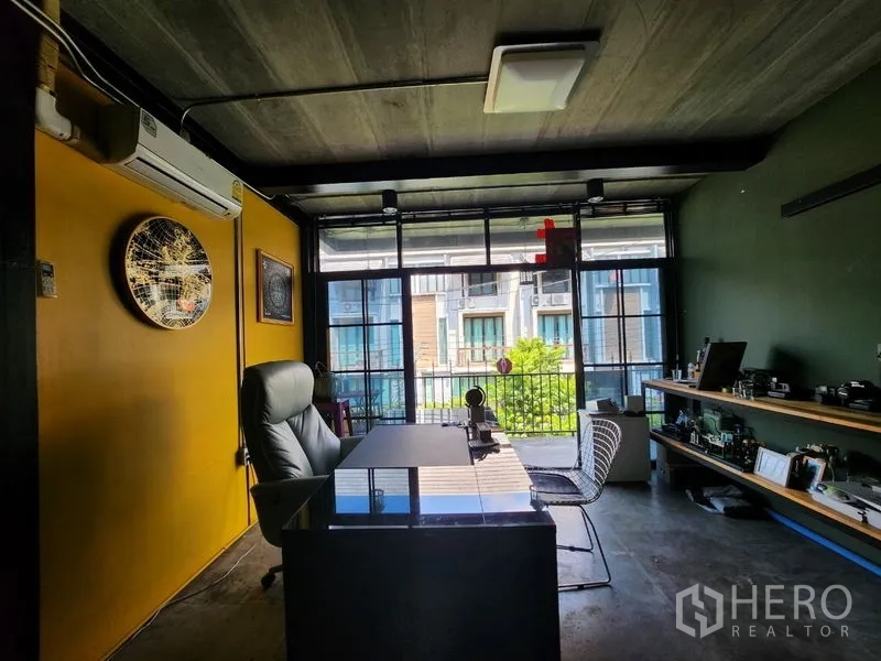 Home Office for sale - Alternate view of the executive office with desk, shelving and green outlook.