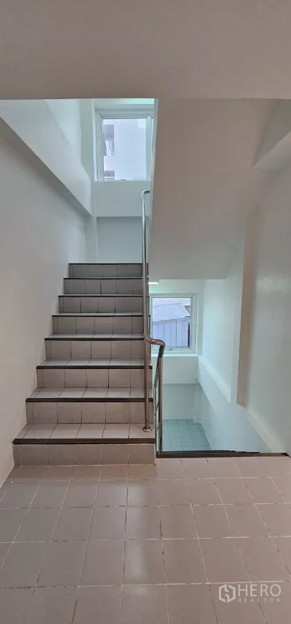 Office Space for rent in Bueng Kum, Bangkok - Well-lit stairwell with tiled steps and windows for natural light.