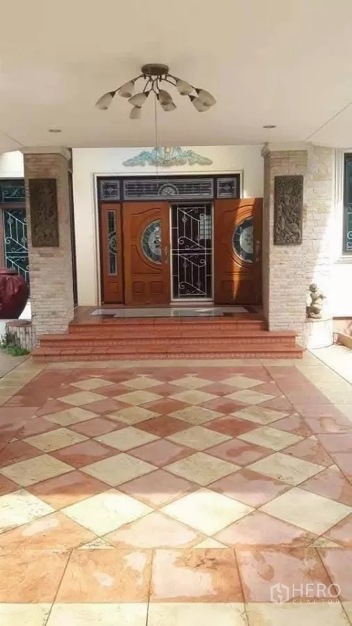 Detached House for sale in Bueng Kum, Bangkok - Grand front entrance with double wooden doors and tiled porch.
