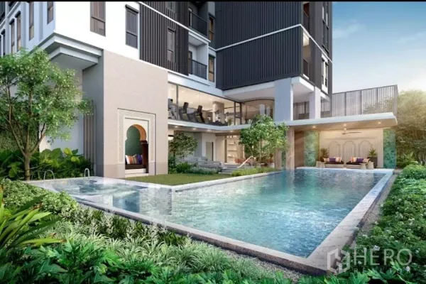 Townhouse for rent in Khlong Toei, Bangkok - Ground‑level pool with garden, covered lounge and contemporary façade.