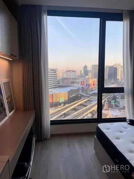Condominium for rent - Window-side workstation with skyline and rail line views over Ladprao.