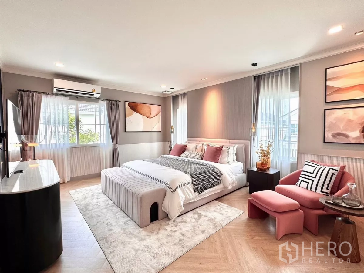 Detached House for rent in Bang Phli, Samut Prakan - Spacious master bedroom with king bed, soft tones and lounge chair.