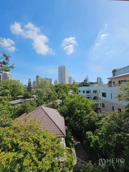 Condominium for rent - Green city view with high-rises above leafy neighborhood near Thonglor BTS.