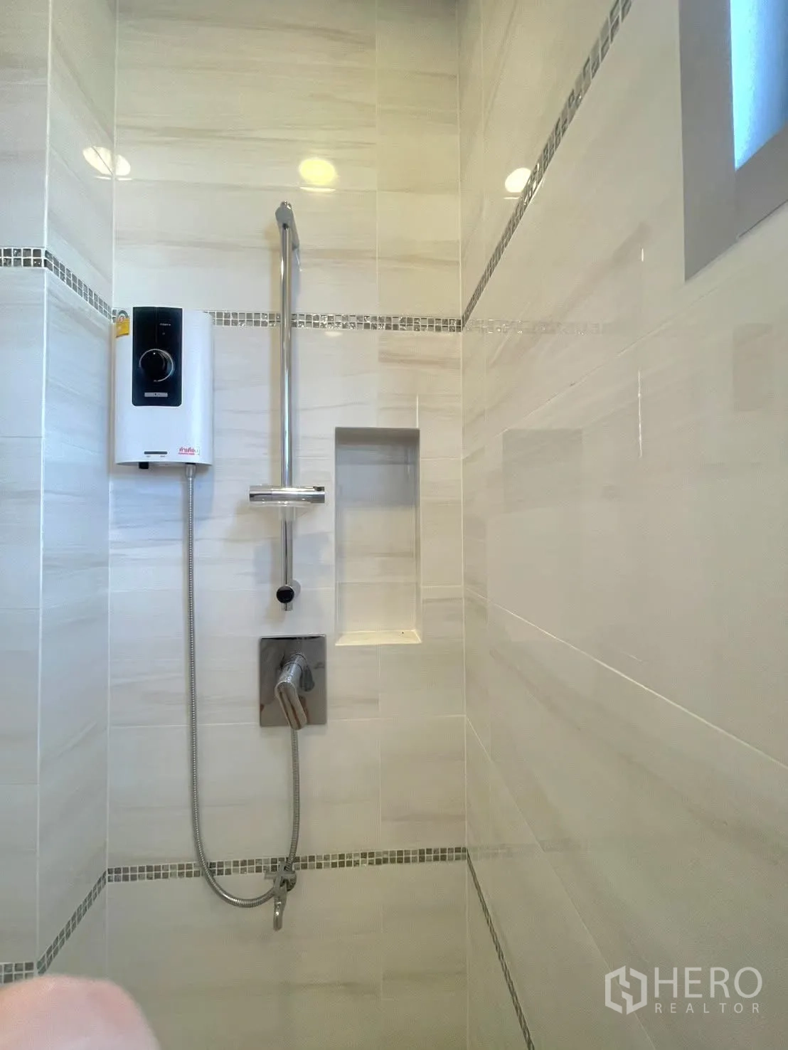 Detached House for rent in Lat Krabang, Bangkok - Tiled shower area with handheld shower and water heater.