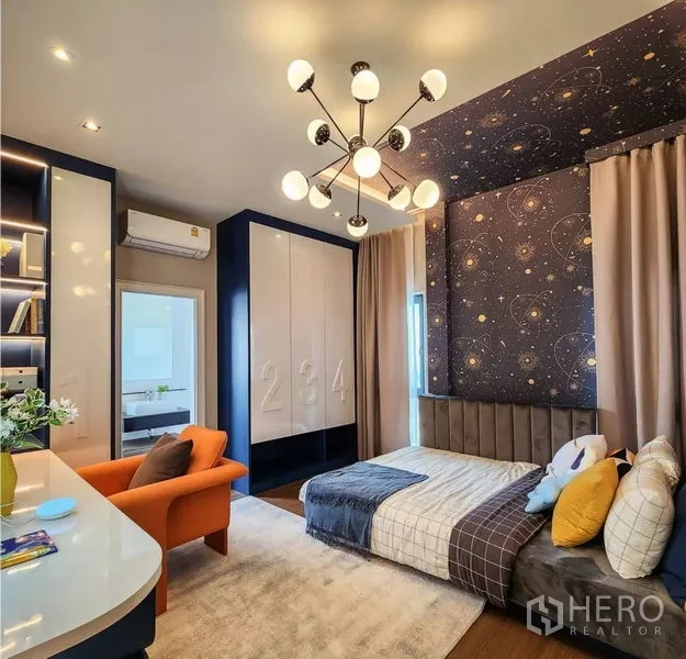 Detached House for sale in Bang Phli, Samut Prakan - Stylish bedroom with galaxy wallpaper, modern chandelier, built-in wardrobe and cozy seating.