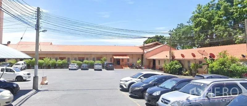 Retail Space for rent in Yan Nawa, Bangkok - On-site car park in front of single-storey buildings with orange tile roofs and surrounding greenery.