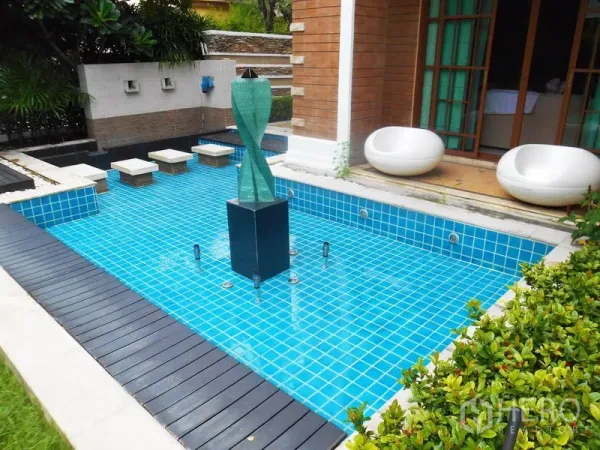Detached House for rent or sale in Bang Phli, Samut Prakan - Blue‑tiled plunge pool with sculptural water feature and deck next to the garden.