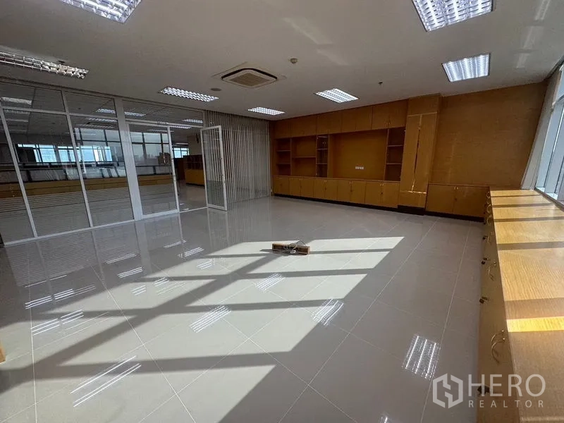 Office Space for rent in Suan Luang, Bangkok - Pantry with L-shaped cabinetry, sink, dark countertops and mosaic backsplash.