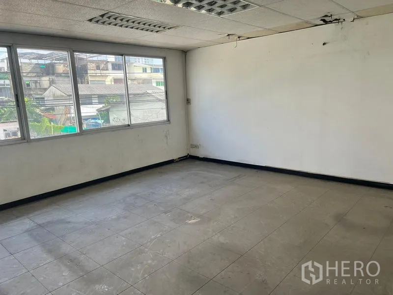 Warehouse for rent in Suan Luang, Bangkok - Private office room with large window overlooking the surrounding neighborhood.