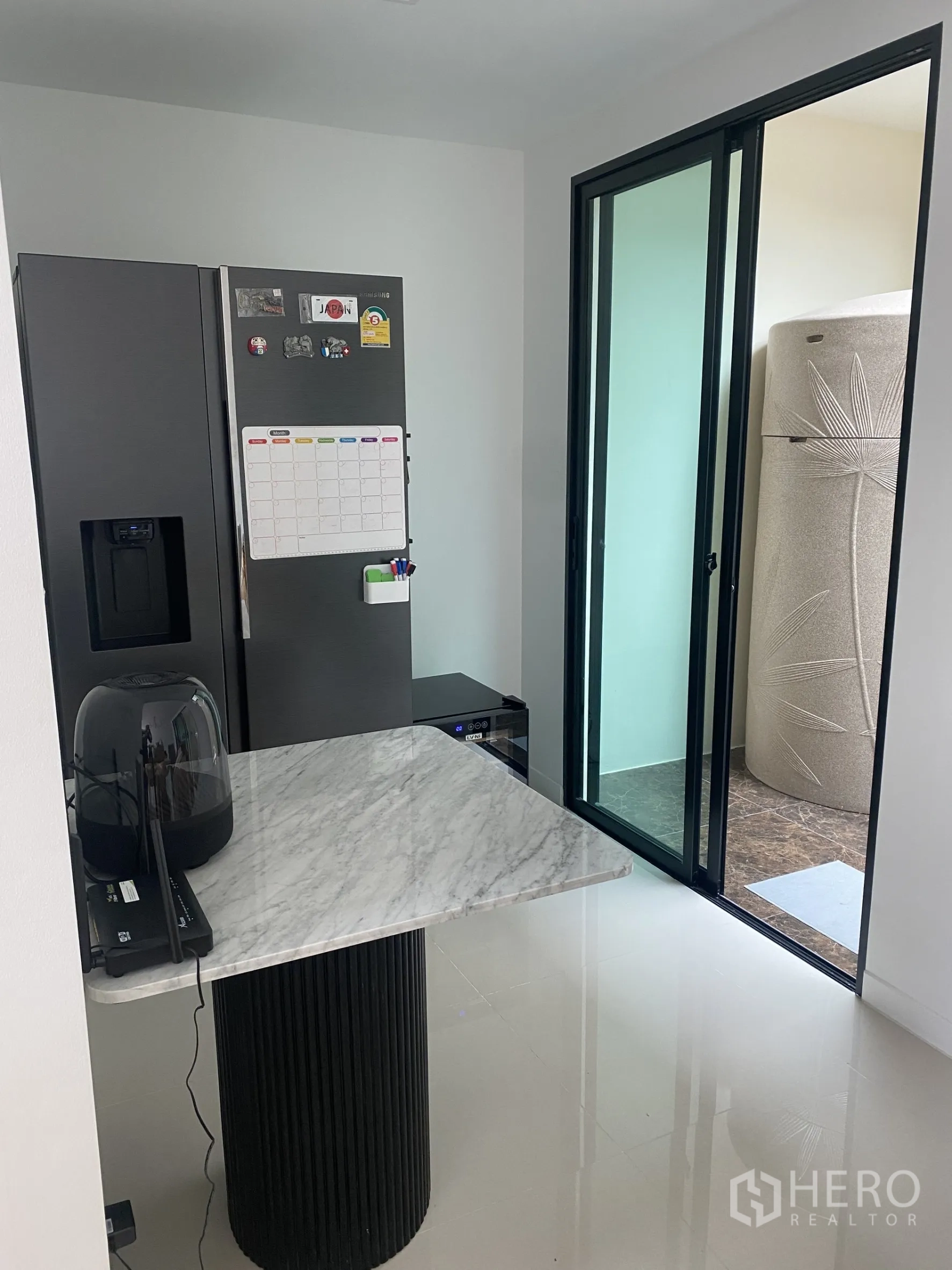 Townhouse for rent or sale in Bang Khae, Bangkok - Pantry connecting to an enclosed terrace via black-framed sliding doors