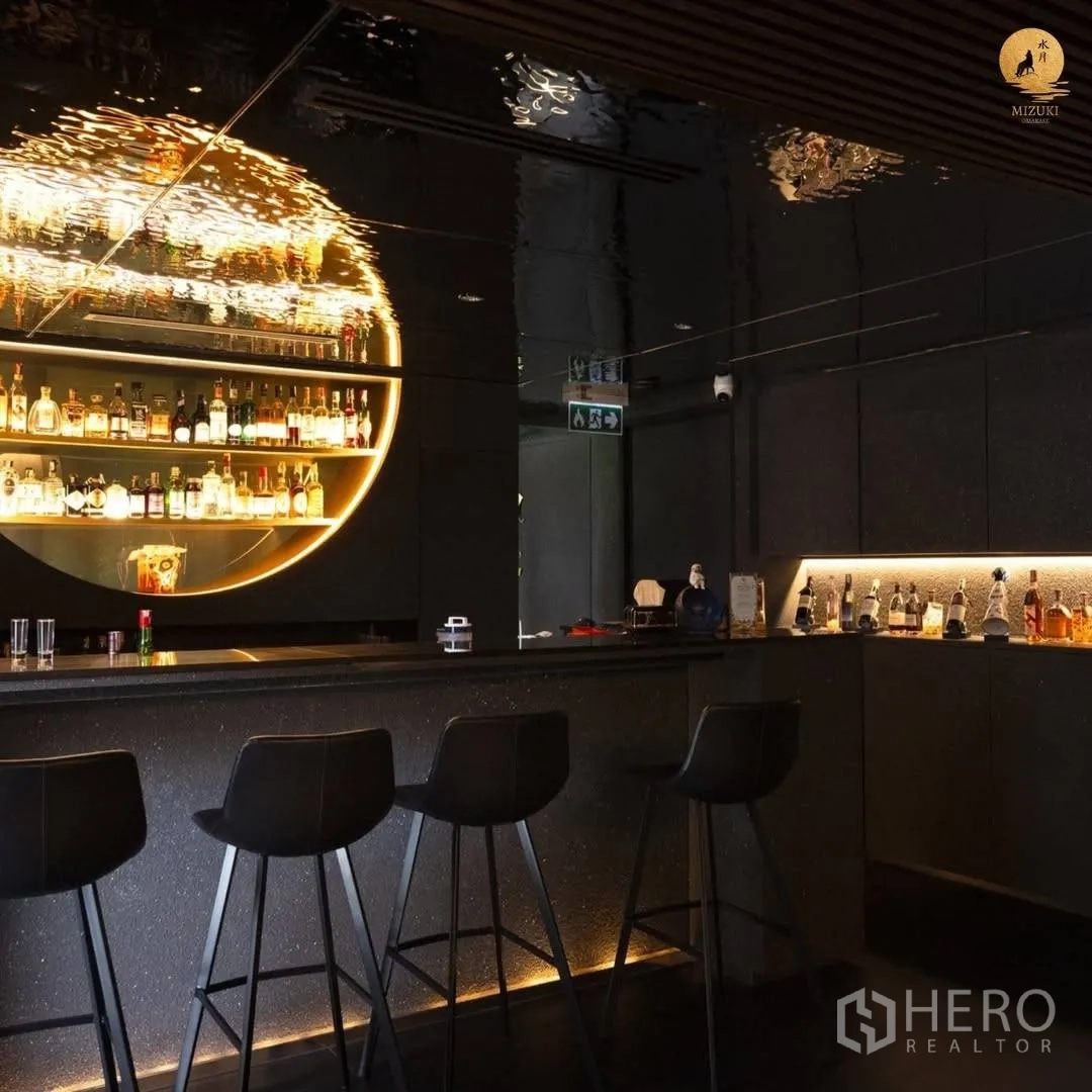 Retail Space for rent in Watthana, Bangkok - Modern black bar with illuminated circular shelf and seating.