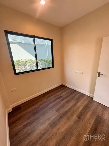 Detached House for rent or sale - Small bedroom with single window, warm wood floor and neutral walls.