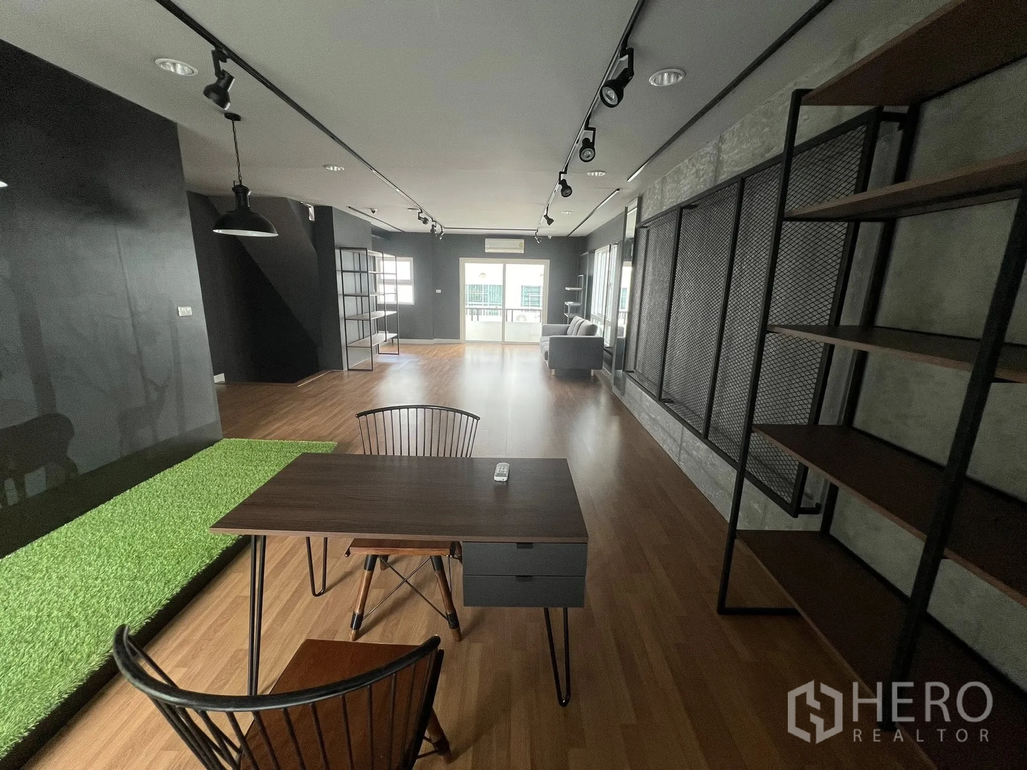 Detached House for rent or sale in Don Mueang, Bangkok - Long workspace with track lights, desk and industrial shelving.