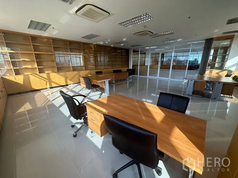 Office Space for rent in Suan Luang, Bangkok - Reception counter with wood paneling in a clean office lobby.
