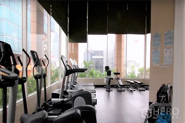 Condominium for rent or sale in Bang Rak, Bangkok - Condo fitness center with cardio machines and city views in Silom, Bangkok.