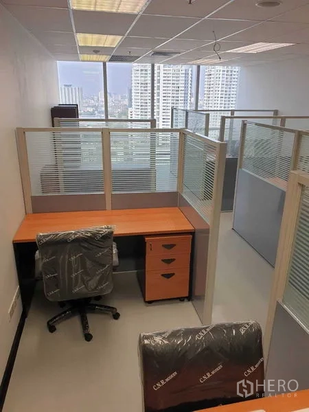 Office Space for rent in Chatuchak, Bangkok - Workstation cubicle with desk, drawers and city skyline view.