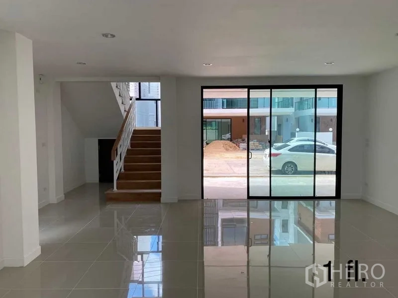 Home Office for rent or sale in Bang Phli, Samut Prakan - Ground-floor office area with full-height sliding glass facing the street and parking.