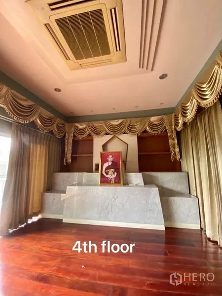 Home Office for rent or sale in Suan Luang, Bangkok - Fourth‑floor multipurpose room with a raised platform and draped curtains.