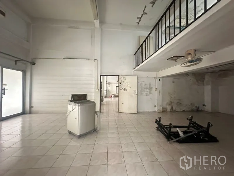 Office Space for rent - Open-plan interior with mezzanine and tiled floors, suitable for showroom