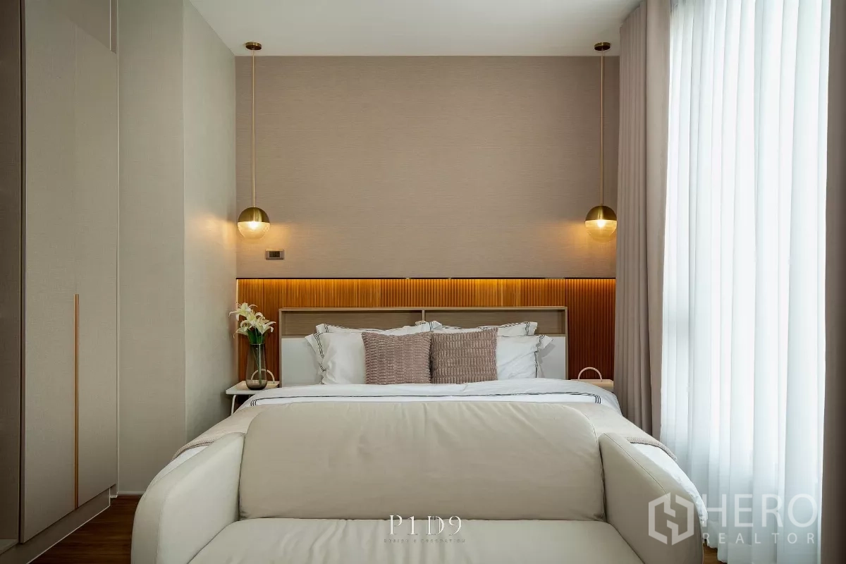 Townhouse for rent in Bang Phli, Samut Prakan - Front view of master bedroom with illuminated headboard and matching bedside lamps
