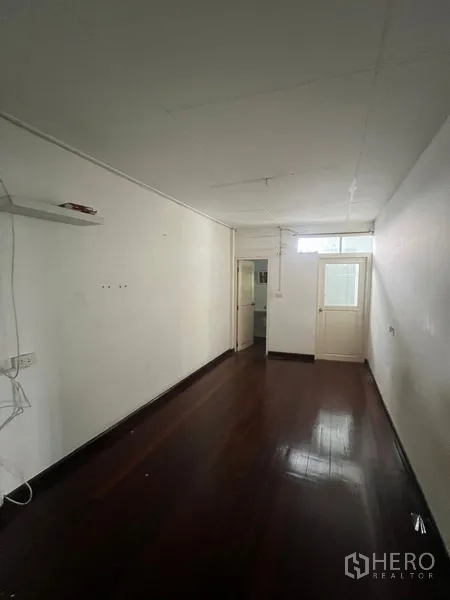 Retail Space for rent in Watthana, Bangkok - Private office room with dark wood flooring and door to a lightwell.