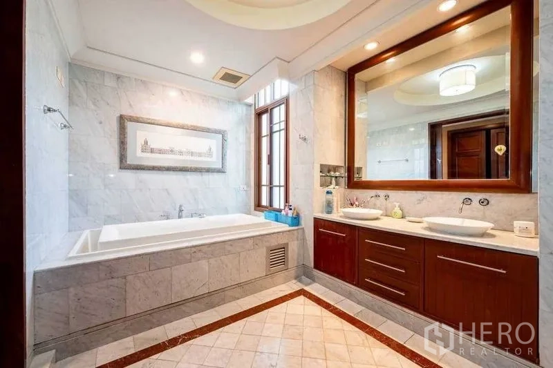 Detached House for sale - Marble bathroom with soaking tub, double vanity and large mirror.