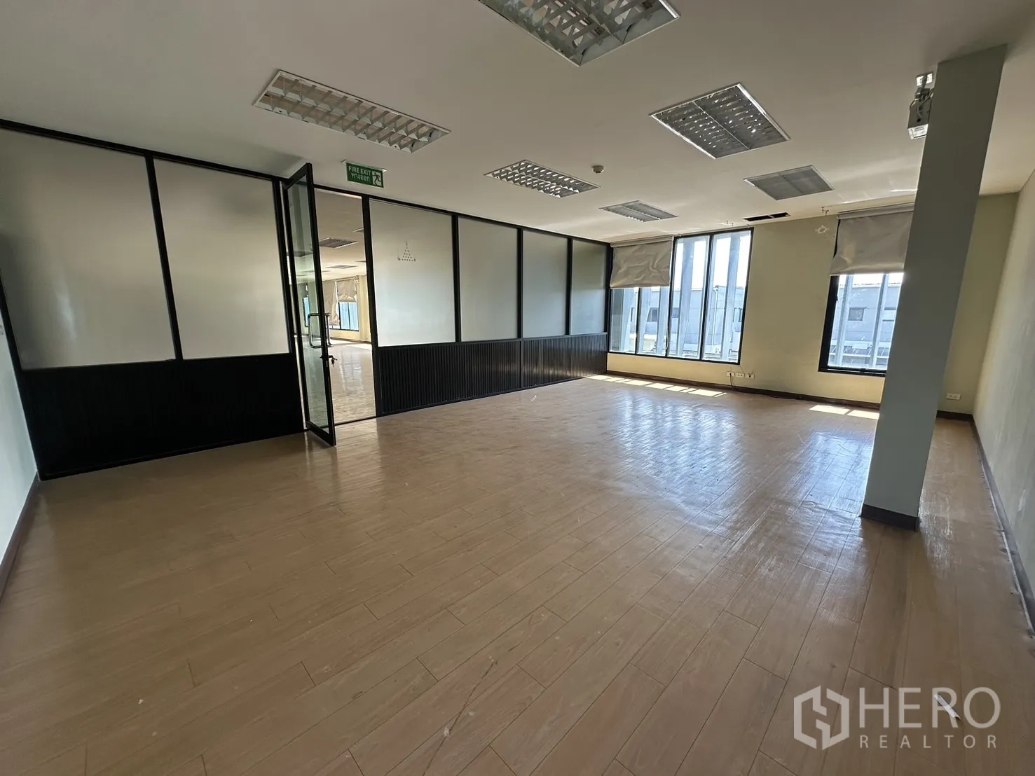 Home Office for rent in Prawet, Bangkok - Expansive open-plan office floor with rows of ceiling lights and side windows.