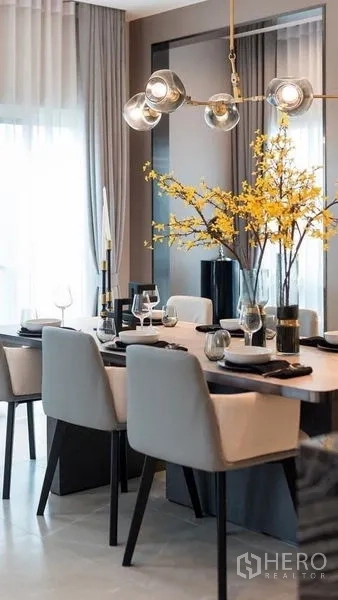 Detached House for rent in Prawet, Bangkok - Elegant dining setup with modern pendant light and tableware details.