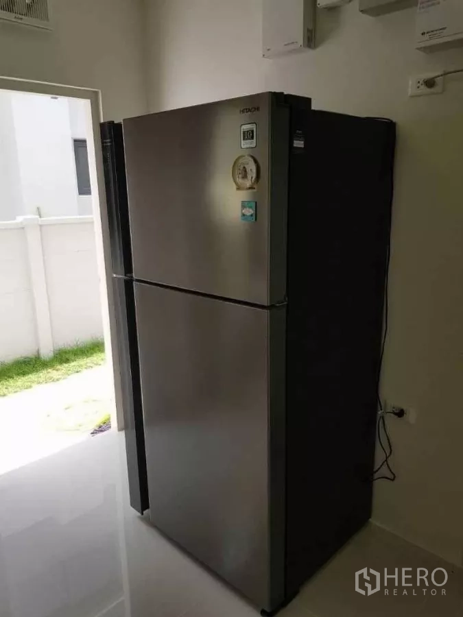 Detached House for rent in Bang Phli, Samut Prakan - Stainless steel double-door refrigerator in the utility area.