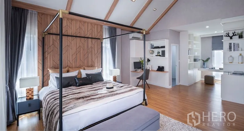 Detached House for sale in Lam Luk Ka, Pathum Thani - Master suite view with work desk, open shelving and seating area under high ceilings.