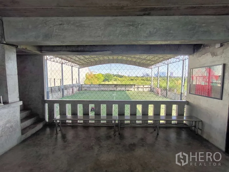 Warehouse for rent in Huai Khwang, Bangkok - Spectator balcony overlooking the covered football pitch through safety netting.