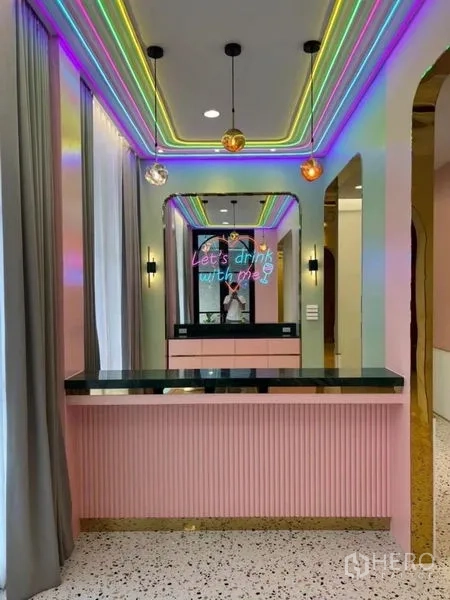 Detached House for rent - Neon-lit home bar with a pastel counter and mirrored backdrop.