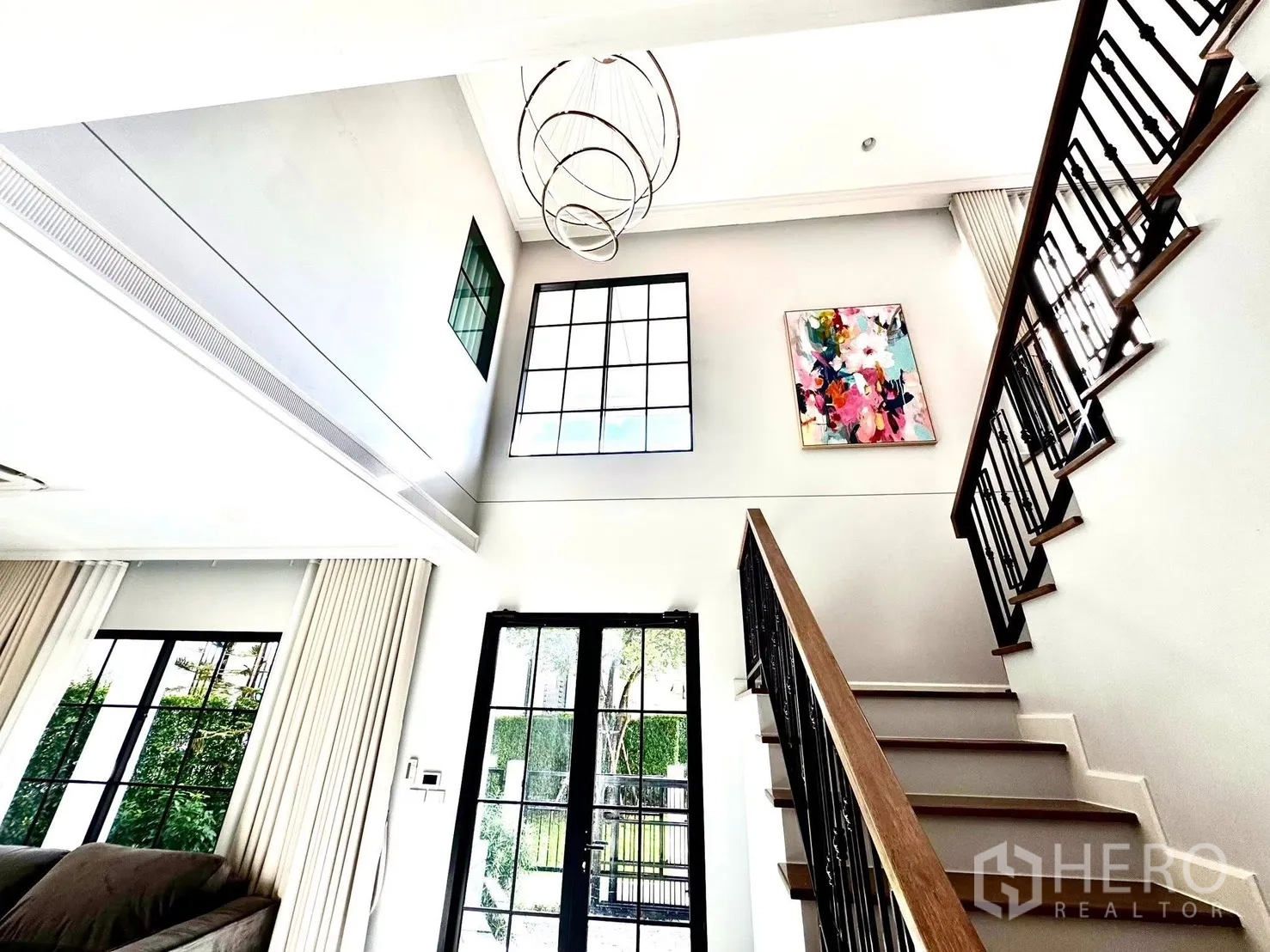 Detached House for rent in Bang Phli, Samut Prakan - Double-height foyer with tall windows, modern ring chandelier and staircase.