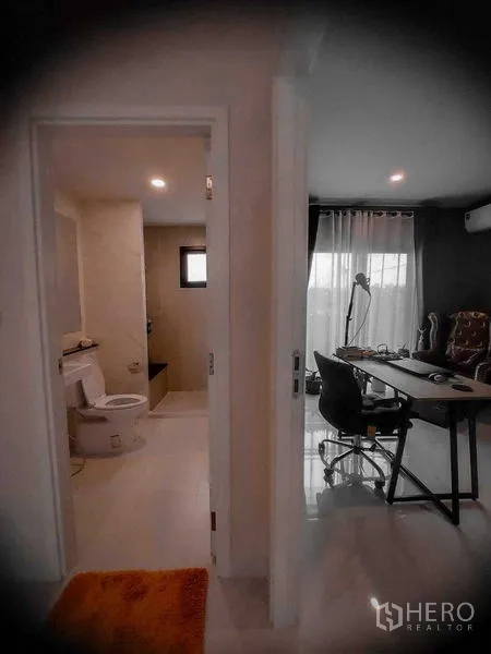 Detached House for rent in Bang Bo, Samut Prakan - Ground-floor hallway showing bathroom entrance and adjacent office.