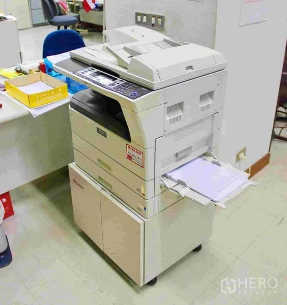 Office Space for rent in Lak Si, Bangkok - Multifunction copier and printer positioned in an open-plan office workspace.