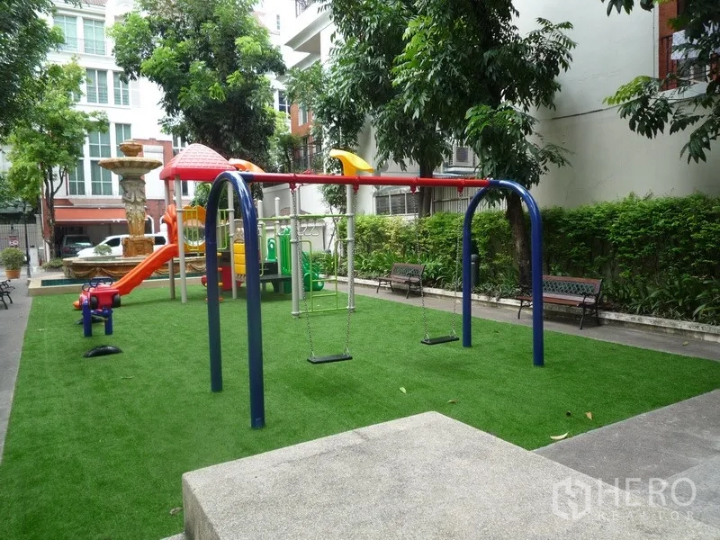 Townhouse for rent in Khlong Toei, Bangkok - Residential playground with swings, slide, benches and trees.