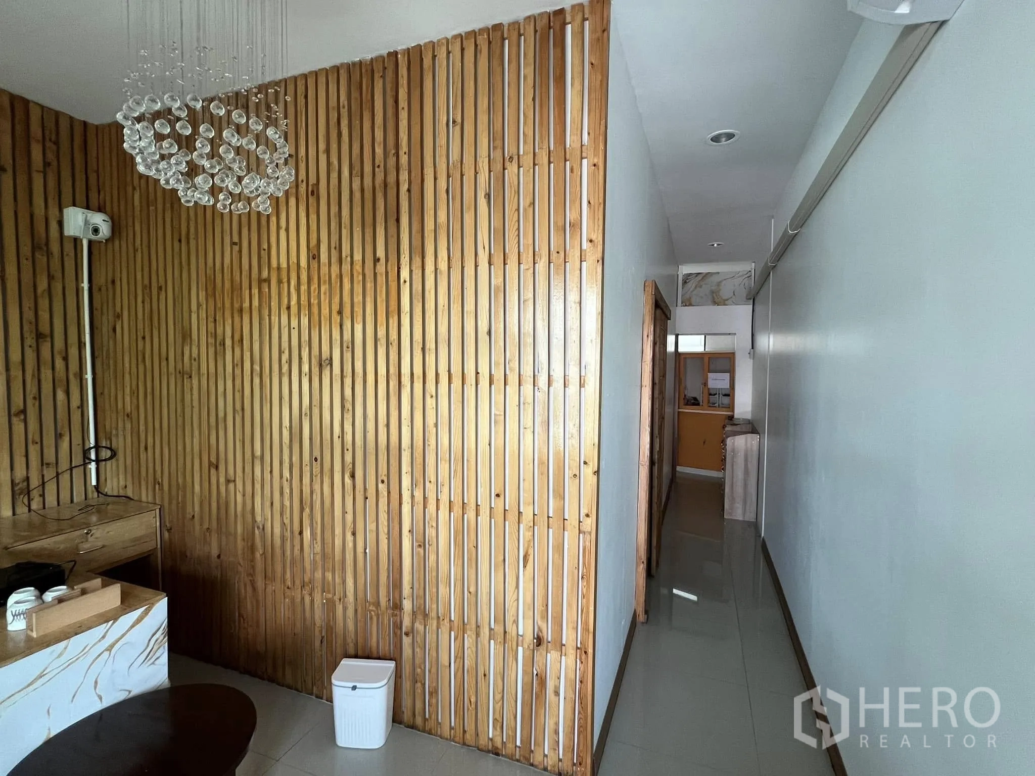 Retail Space for rent in Lat Phrao, Bangkok - Reception area with wooden slat feature wall and corridor view.