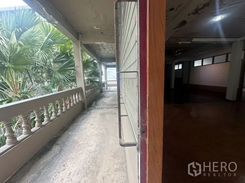 Office Space for rent - External balcony walkway lined with palm trees outside