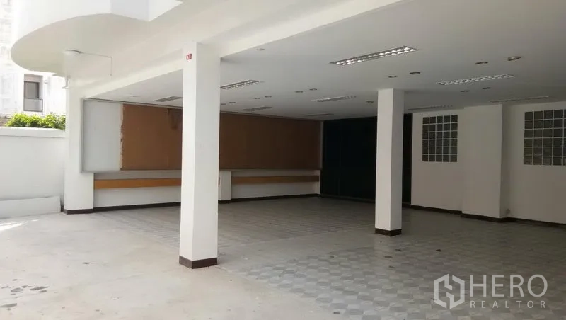 Office Space for rent in Sathon, Bangkok - Spacious open workspace with support columns, drop-ceiling lighting, and tiled flooring.
