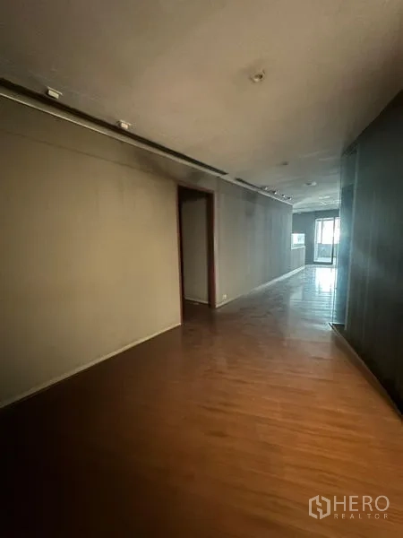 Office Space for rent in Watthana, Bangkok - Wood-floored hallway leading toward the entrance and side doorway