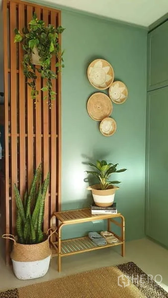 Detached House for sale in Bang Phli, Samut Prakan - Decorative green accent wall with wood slats and potted plants