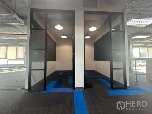 Office Space for rent in Bang Rak, Bangkok - Two compact meeting rooms with glass doors and pendant lights in an open-plan office.