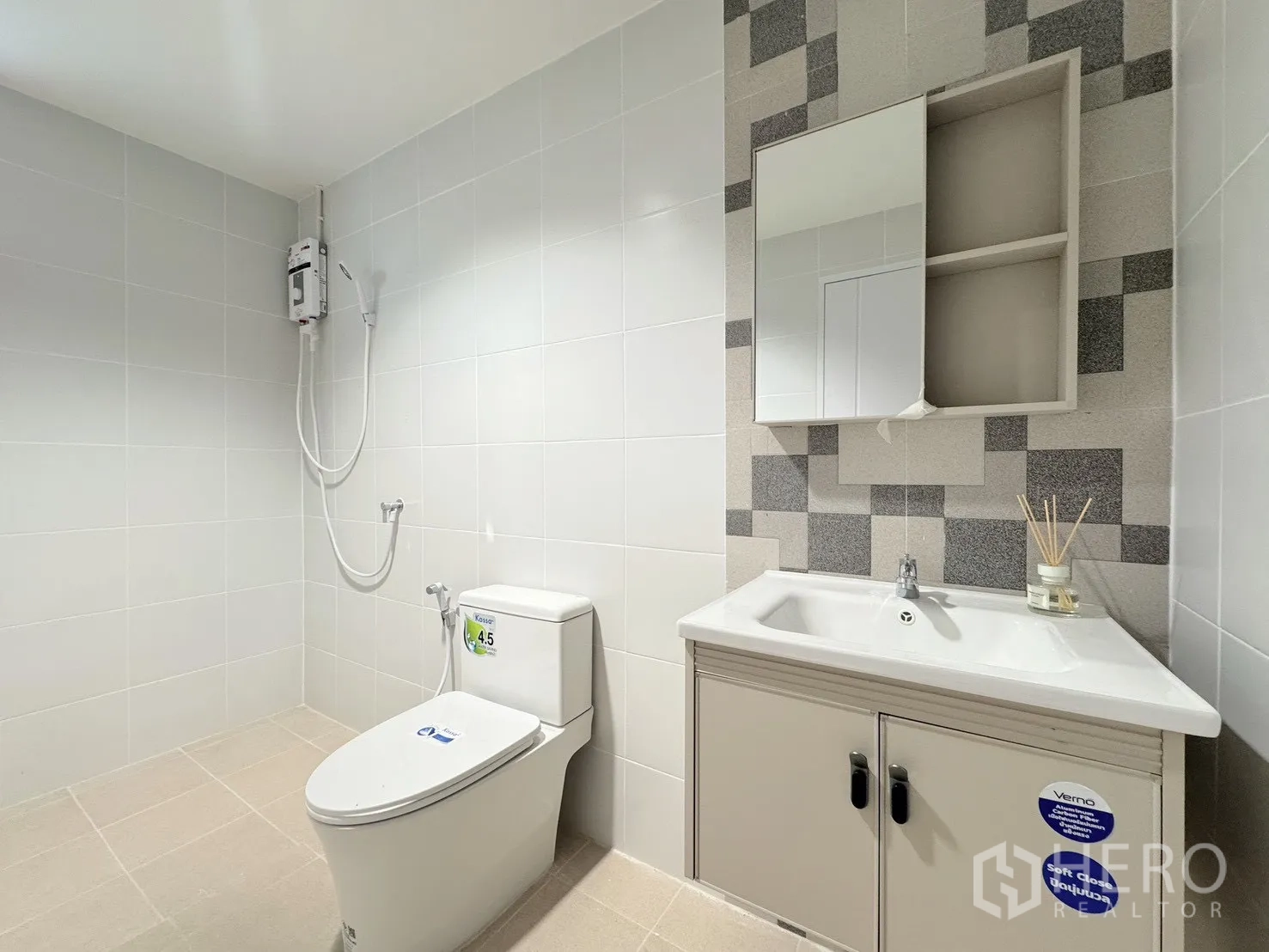 Detached House for rent - Clean bathroom with vanity cabinet, toilet and shower heater.