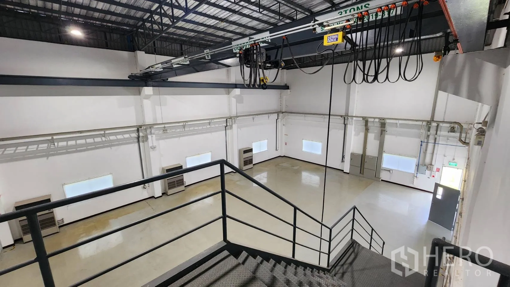 Factory for sale in Bang Bo, Samut Prakan - Office corridor with observation window into clean production area.