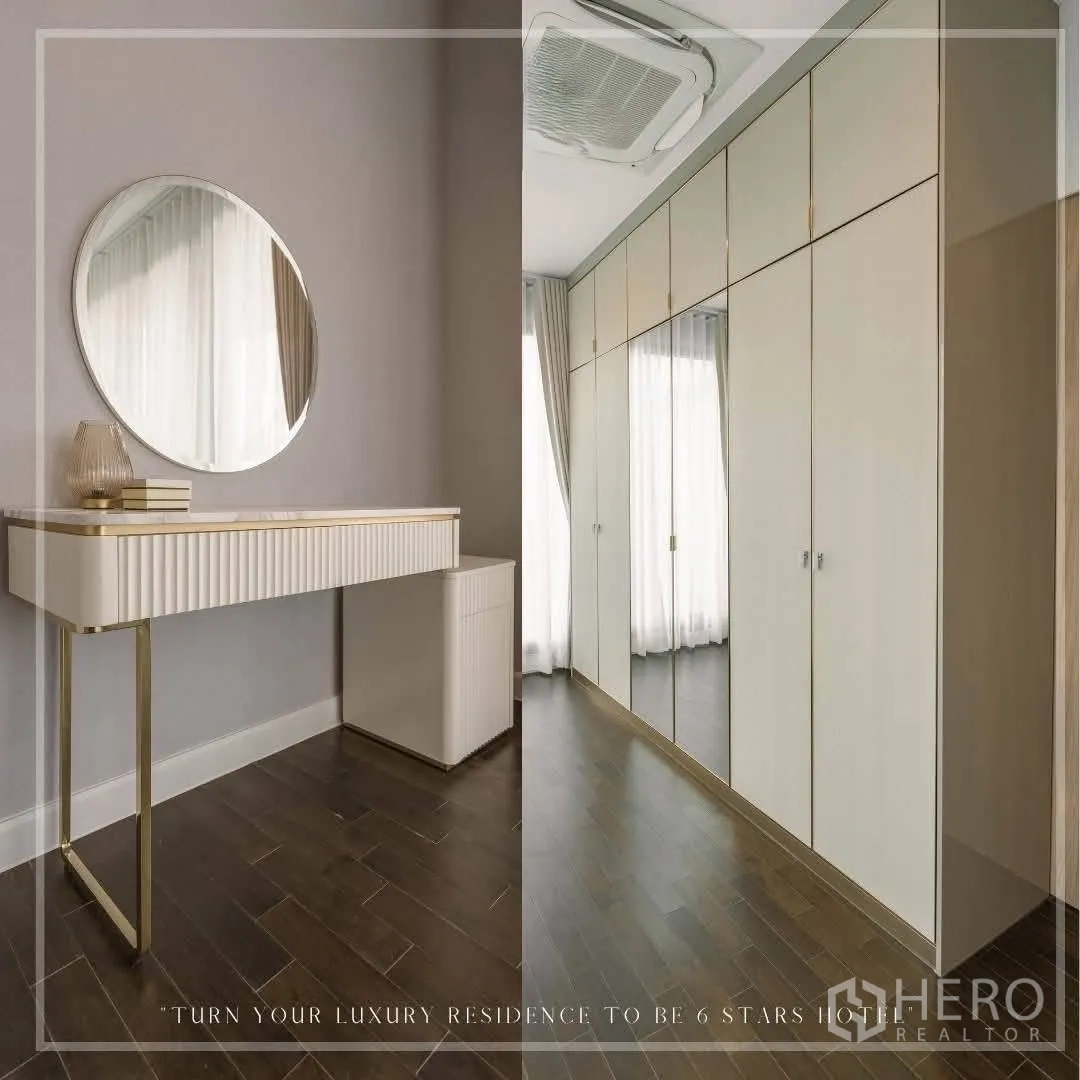 Detached House for rent or sale in Suan Luang, Bangkok - Vanity table with round mirror and a corridor lined with tall wardrobes.