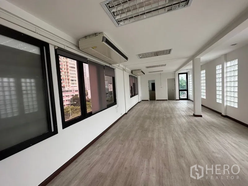 Office Space for rent in Sathon, Bangkok - Bright open-plan office in Sathon, Bangkok with wood-look flooring, large windows, air-conditioning and city outlook.