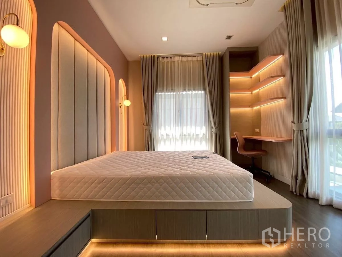Detached House for rent in Bang Phli, Samut Prakan - Stylish second bedroom with platform bed, warm LED strip lighting and a corner study desk.